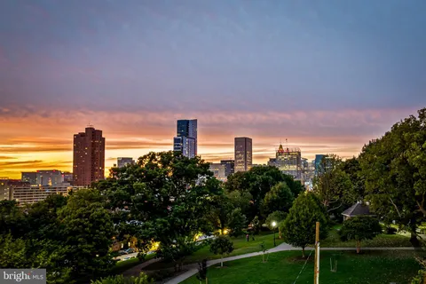 a large kitchen with a table and chairs