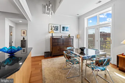 a bathroom with a sink double vanity granite tub and a mirror