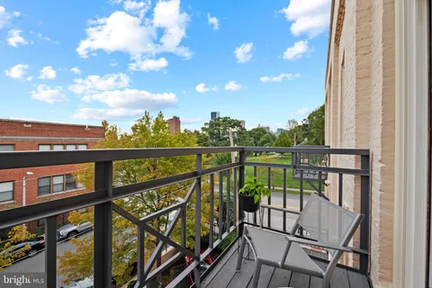 a view of a building with a street