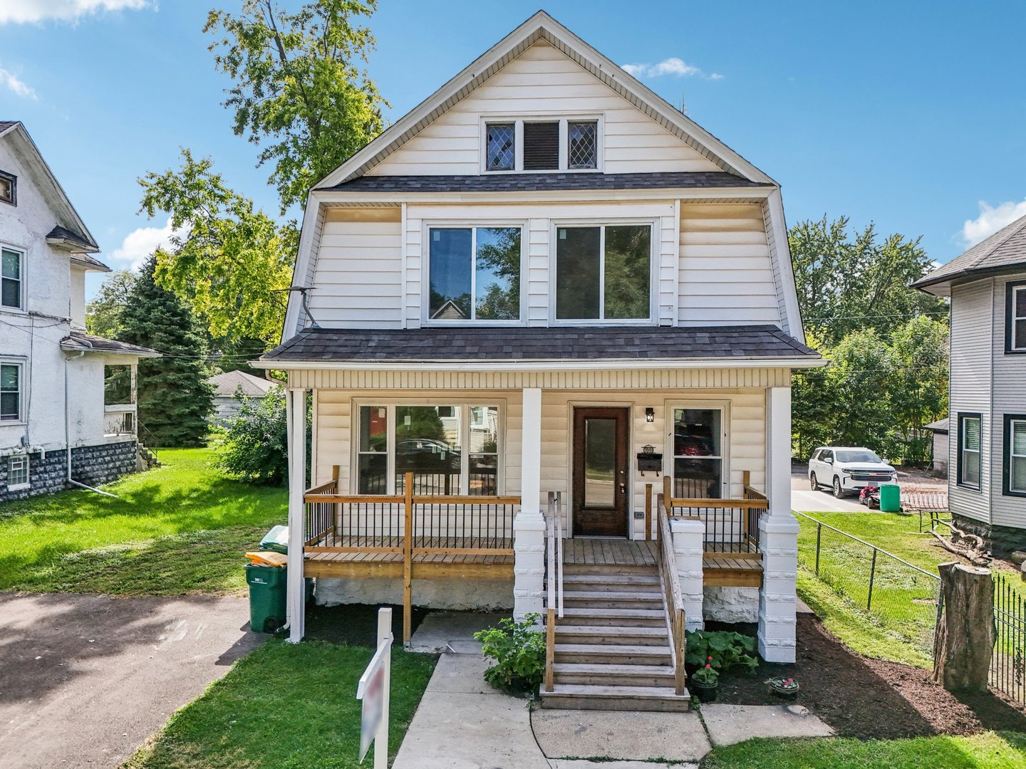 a view of a house with a yard porch and sitting area