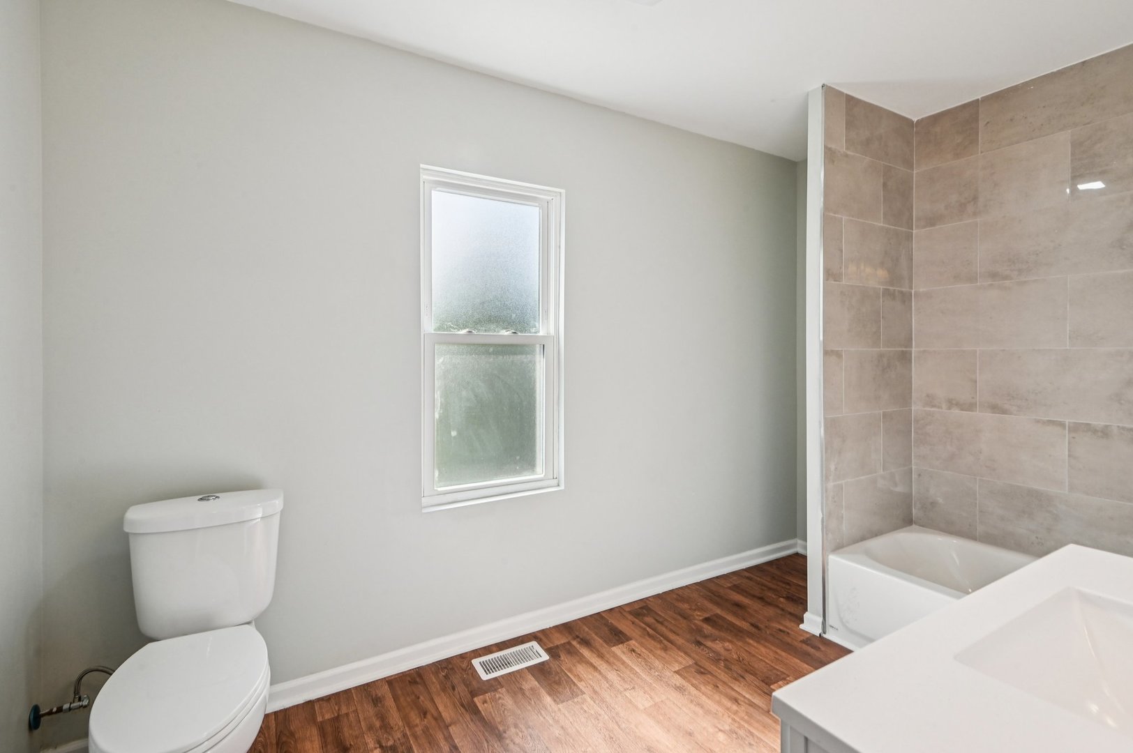 608 Whitley Avenue Joliet, IL 60433 - Photo 28 of 38 a bathroom with a toilet and a sink