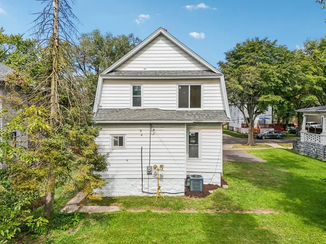 a view of a house with a yard