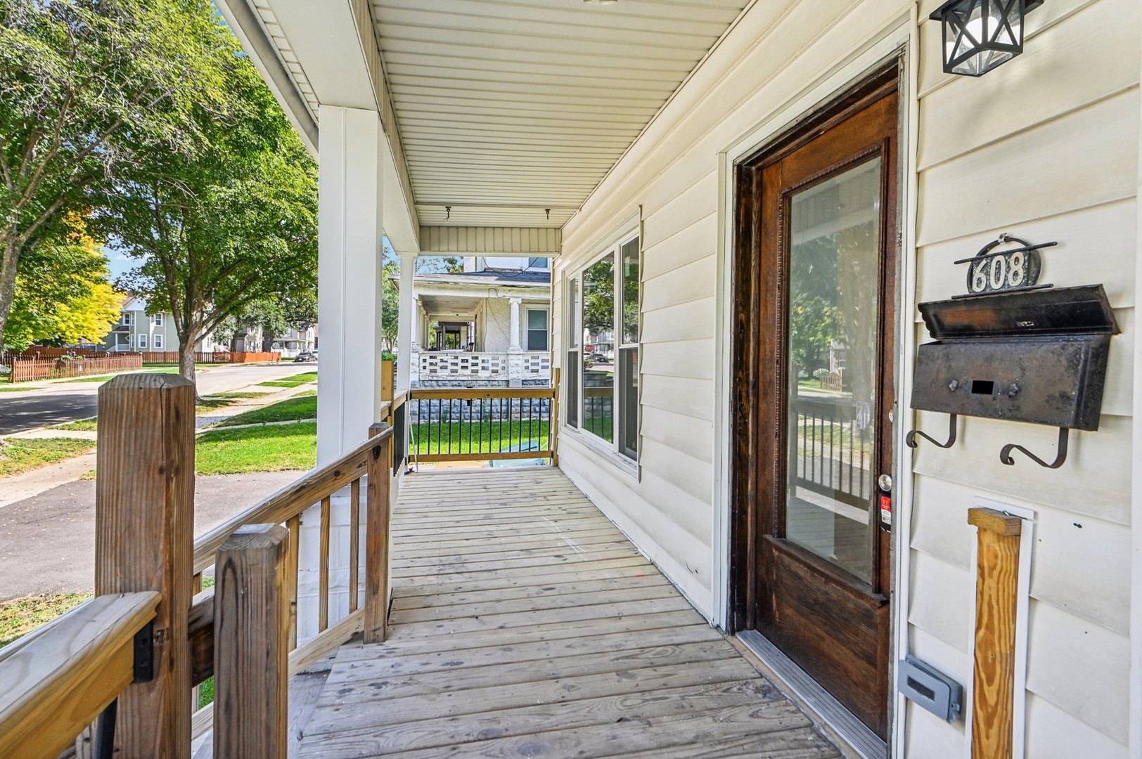 608 Whitley Avenue Joliet, IL 60433 - Photo 5 of 38 a view of a porch with wooden floor and outdoor seating