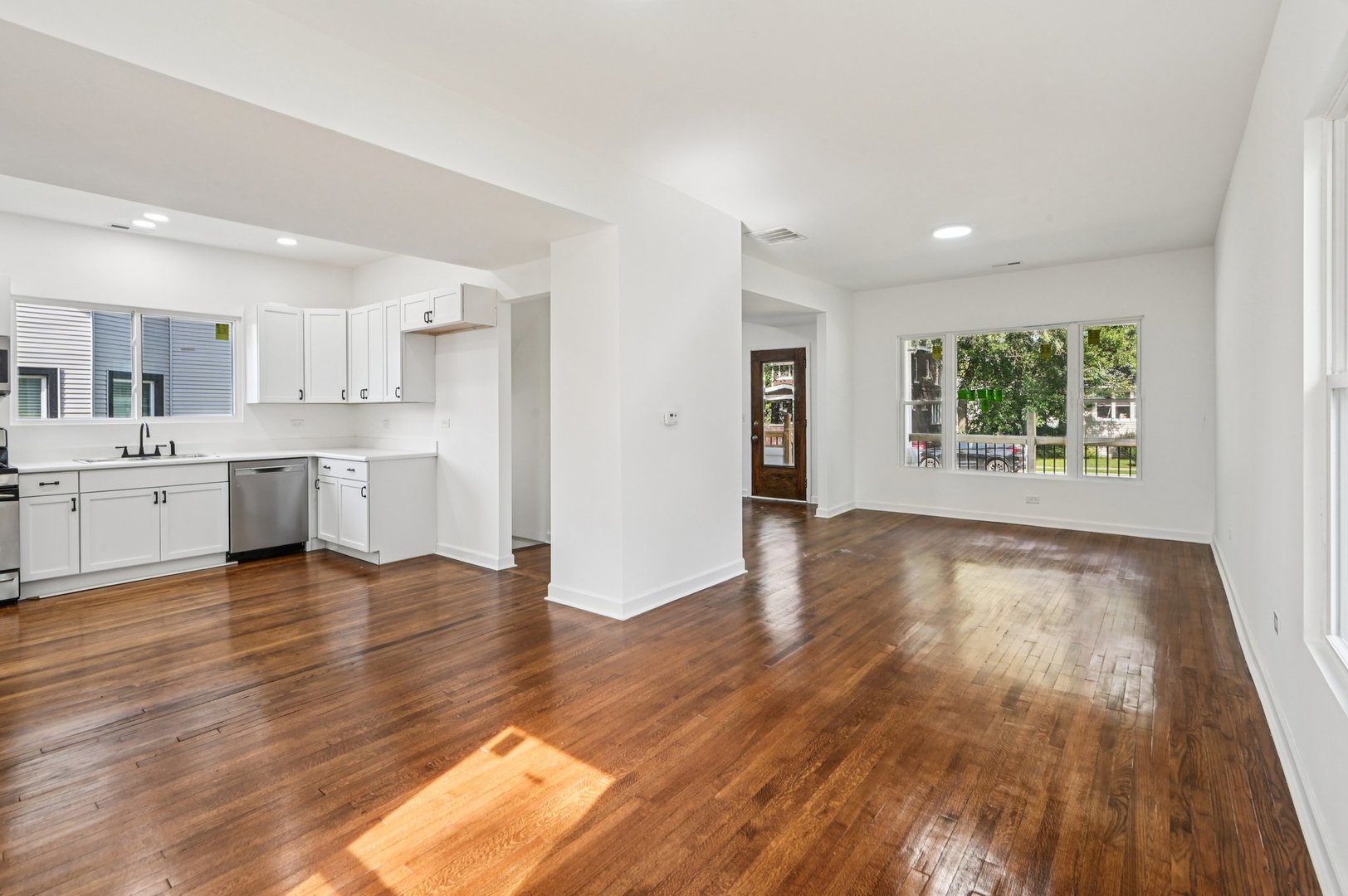 608 Whitley Avenue Joliet, IL 60433 - Photo 10 of 38 a view of kitchen with wooden floor and window