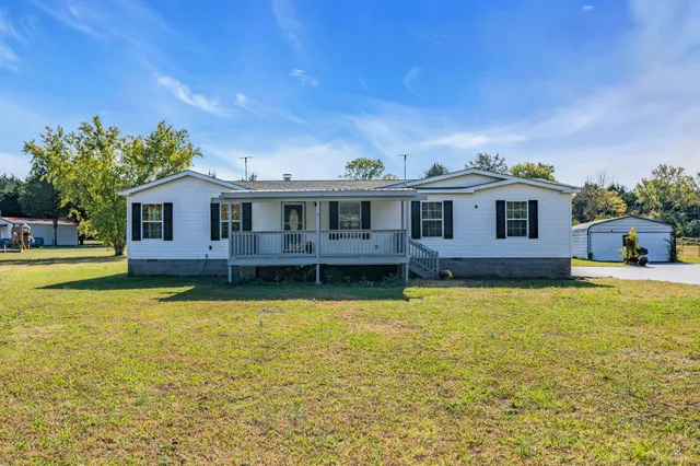 a view of a house with swimming pool