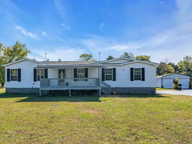a view of a house with pool yard and a big yard