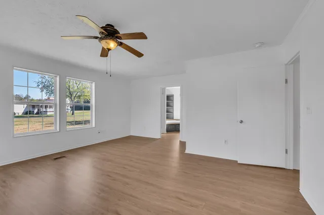 a living room with a couch and a window