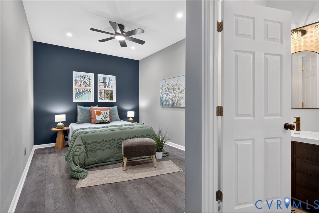 1952 Powell Road Richmond, VA 23224 - Photo 16 of 36 a bedroom with a bed and a chandelier