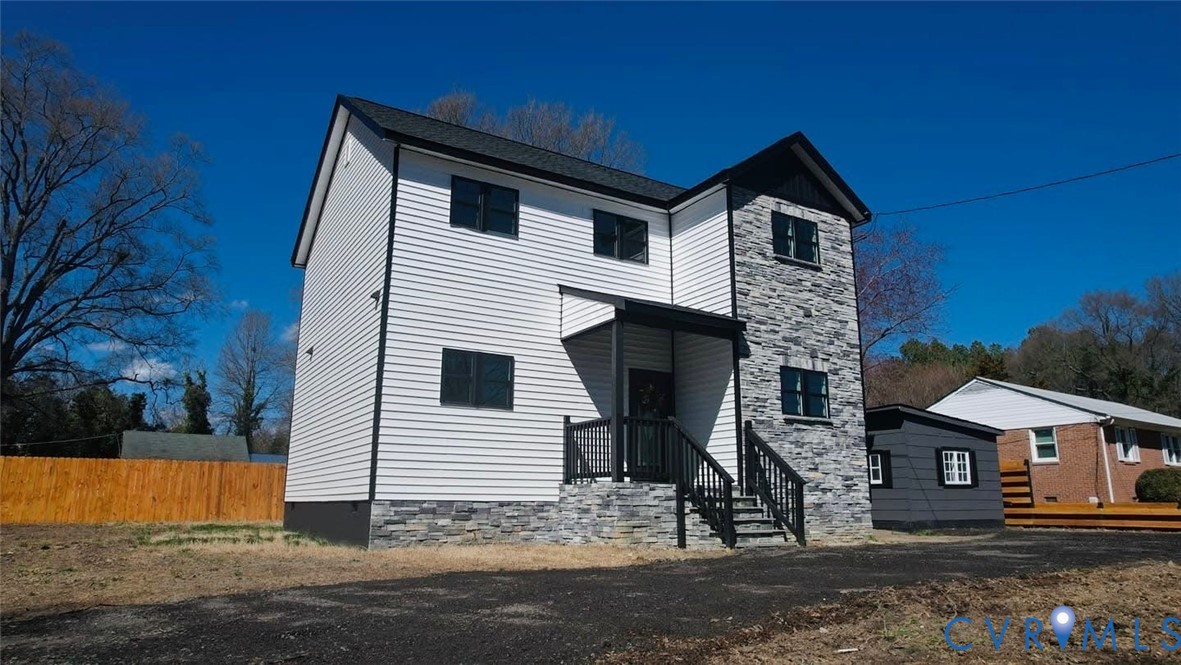 1952 Powell Road Richmond, VA 23224 - Photo 2 of 36 a front view of a house with a yard