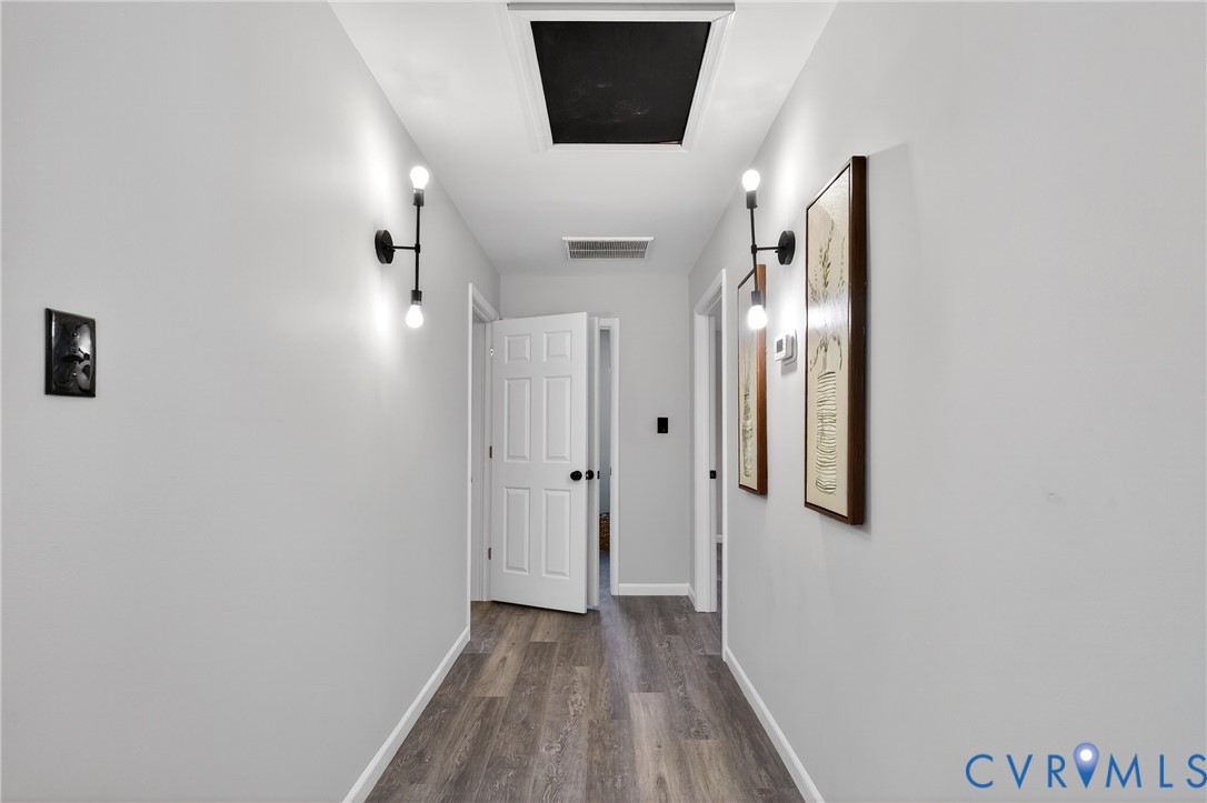 1952 Powell Road Richmond, VA 23224 - Photo 22 of 36 a view of a hallway with wooden floor