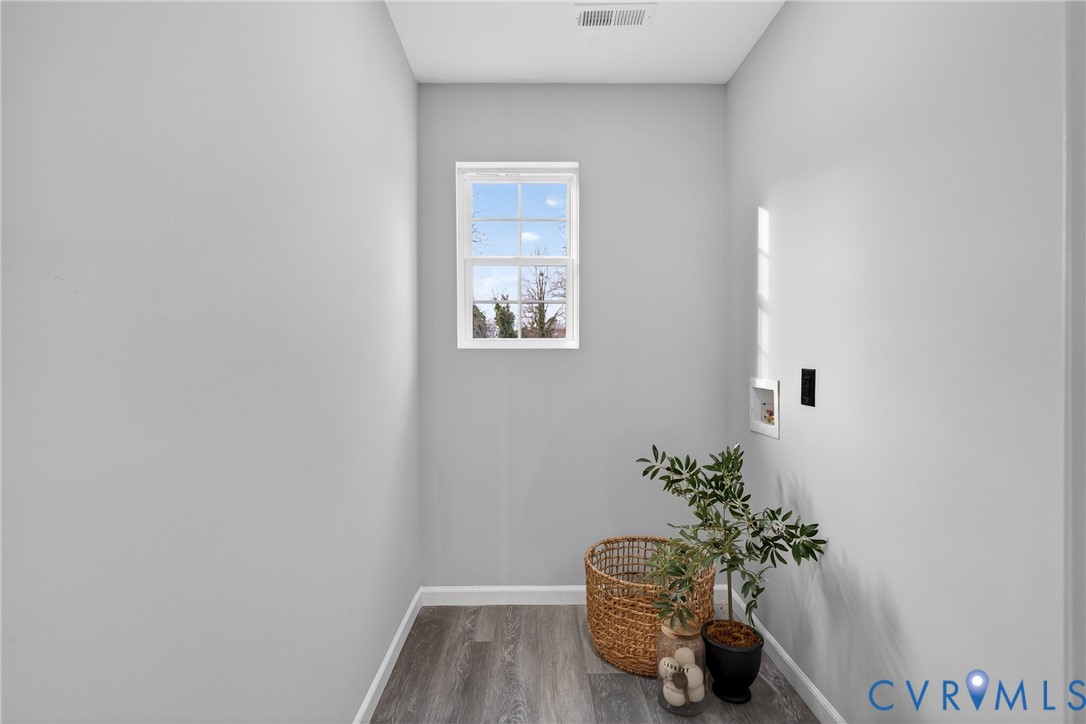 1952 Powell Road Richmond, VA 23224 - Photo 24 of 36 a room with a potted plant and a table