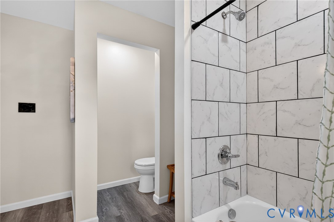 1952 Powell Road Richmond, VA 23224 - Photo 26 of 36 a bathroom with a toilet and shower