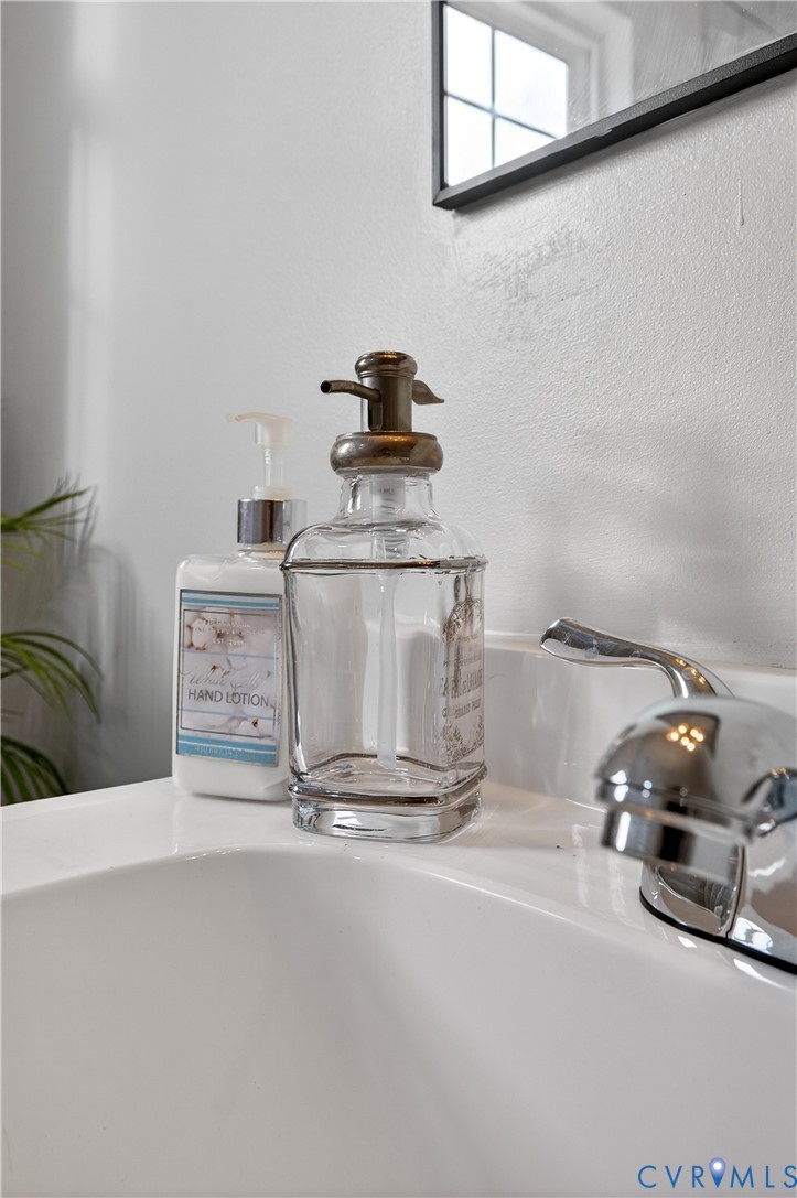 1952 Powell Road Richmond, VA 23224 - Photo 28 of 36 a kitchen with a sink and a stove with a dining table