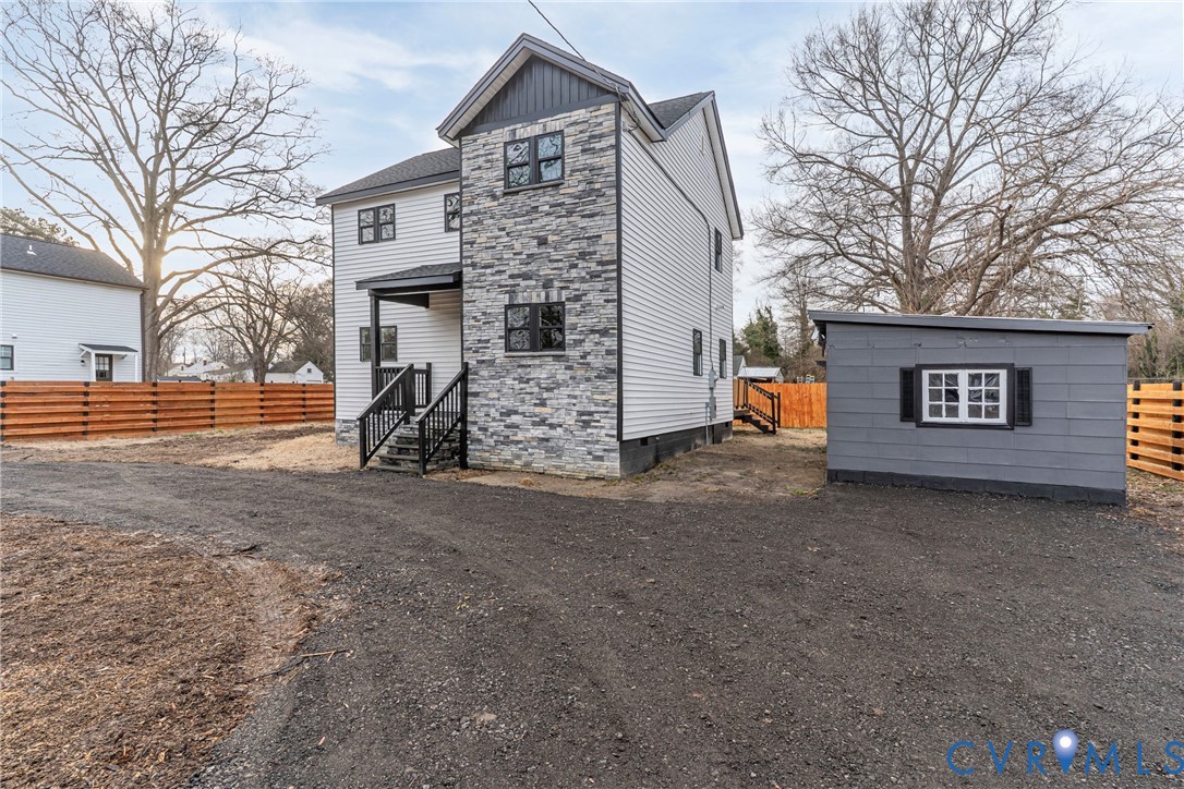 1952 Powell Road Richmond, VA 23224 - Photo 5 of 36 a view of a house with a yard and garage