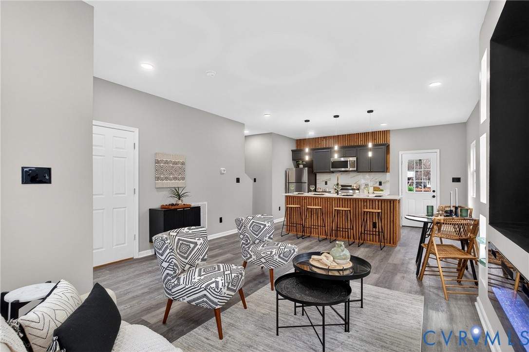 1952 Powell Road Richmond, VA 23224 - Photo 9 of 36 a living room with furniture and a wooden floor