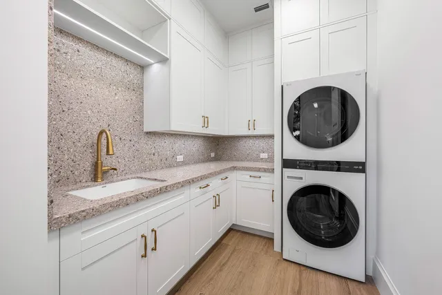 a view of entryway with a window and wooden floor