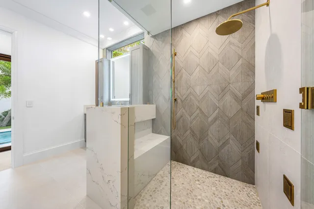 a bathroom with a toilet a sink a vanity and mirror