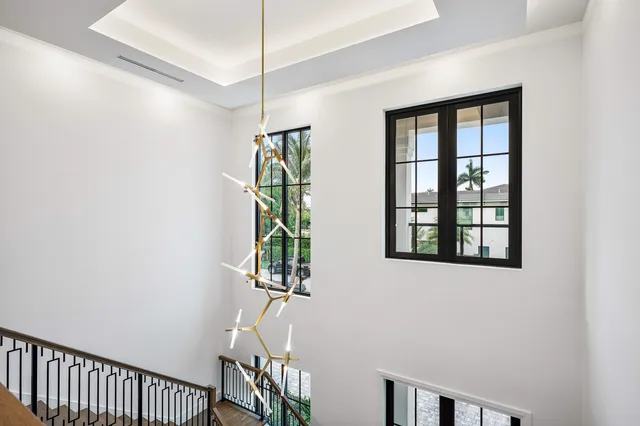 a front view of a house with a garden and plants