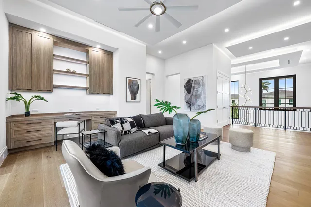 a living room with couch and a large window