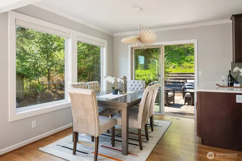 a view of kitchen with dining table and chairs