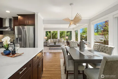 a kitchen with kitchen island a sink appliances and a counter top space