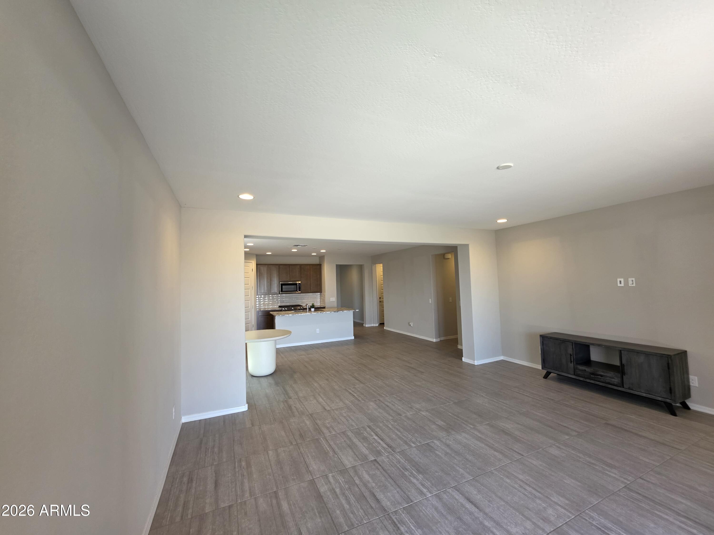 7128 West Coles Road Laveen, AZ 85339 - Photo 9 of 38 a view of a kitchen and an empty room