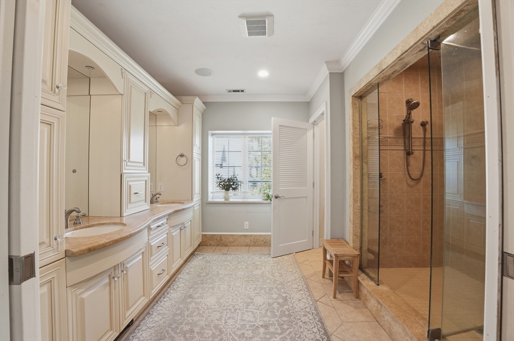 183 Whiting Street Hanover, MA 02339 - Photo 21 of 42 a bathroom with a double vanity sink and mirror with shower