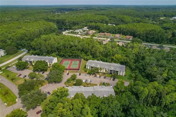 an aerial view of a house with a lake view