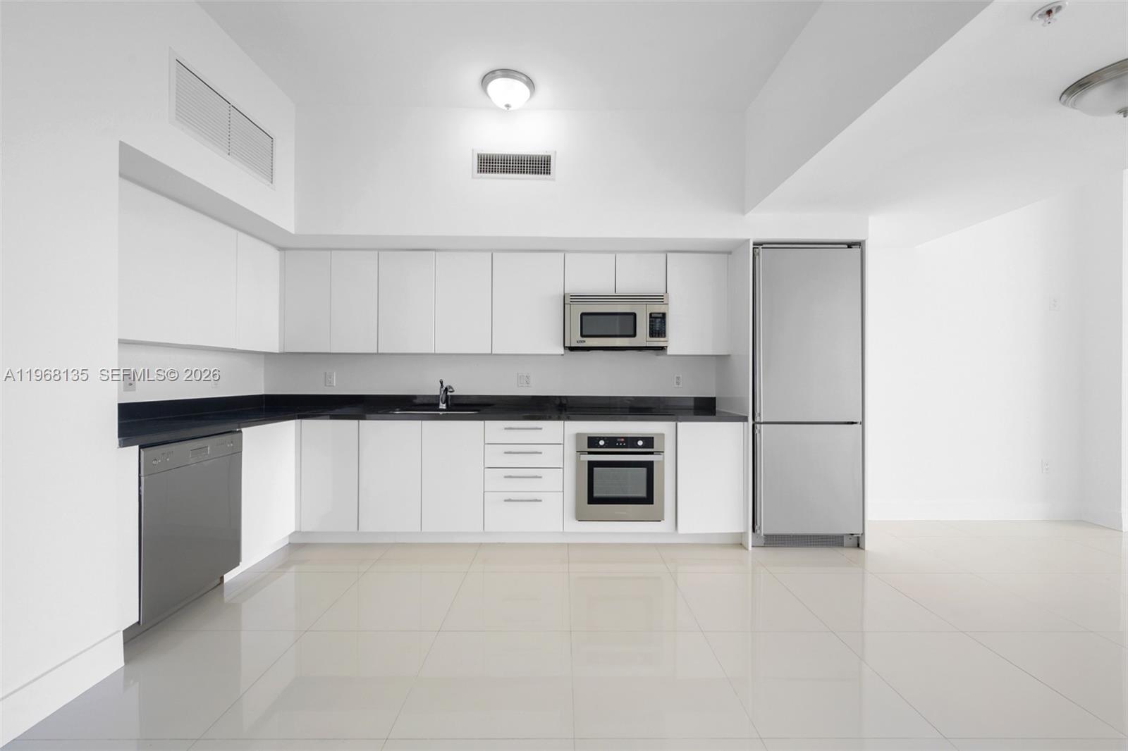92 Southwest 3rd Street, Unit 5109 Miami, FL 33130 - Photo 2 of 27 a kitchen with stainless steel appliances a refrigerator sink and stove