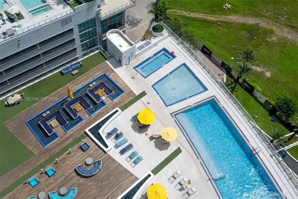 a aerial view of house with yard