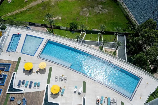 a view of swimming pool with a patio