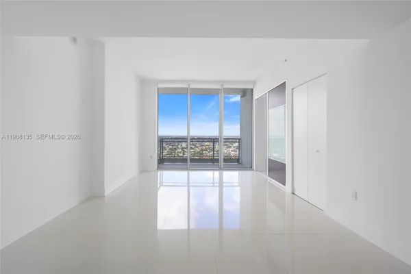 a view of an empty room and window