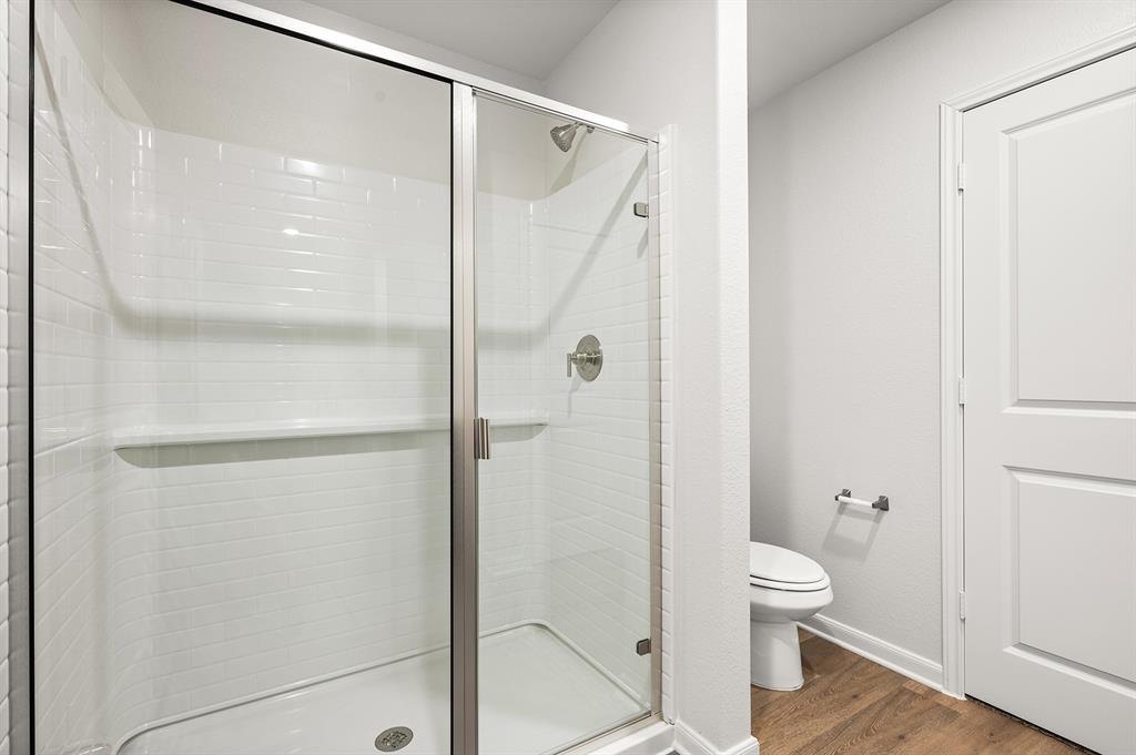 307 Patton Lane Venus, TX 76084 - Photo 6 of 8 a bathroom with a shower and a toilet