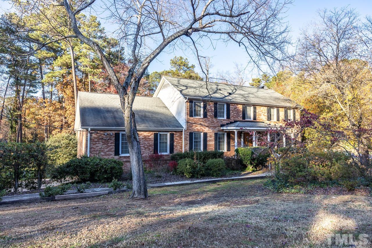 3100 Braddock Drive Raleigh, NC 27612 - Photo 1 of 40 a front view of a house with yard and green space