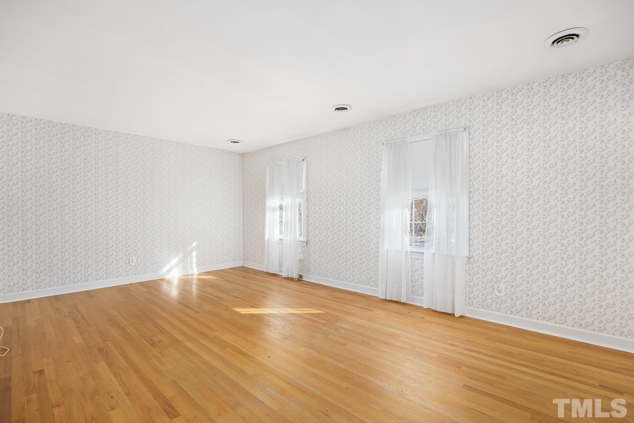 3100 Braddock Drive Raleigh, NC 27612 - Photo 18 of 40 a view of an empty room with wooden floor