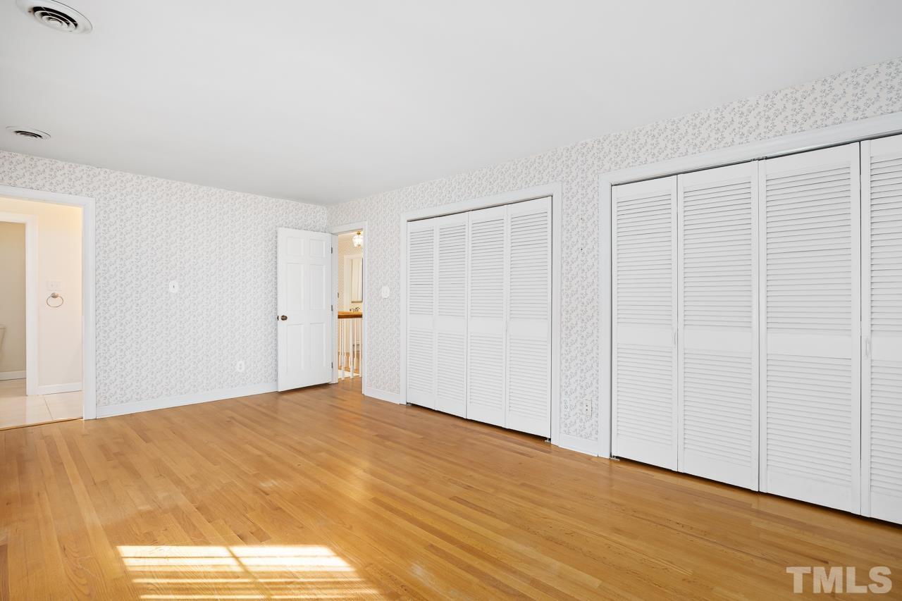 3100 Braddock Drive Raleigh, NC 27612 - Photo 19 of 40 a view of empty room with wooden floor