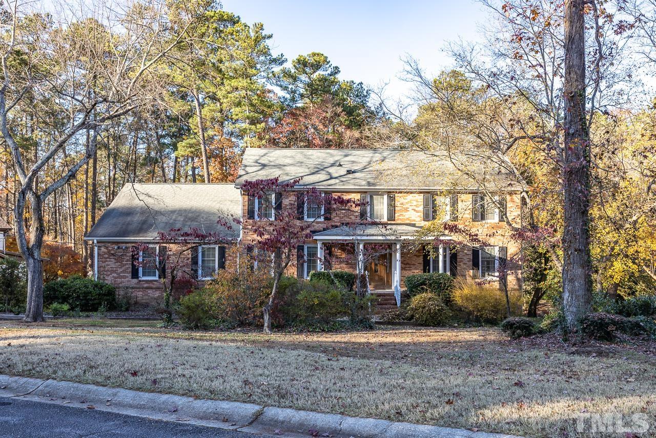 3100 Braddock Drive Raleigh, NC 27612 - Photo 2 of 40 a view of a white house next to a yard with a tree