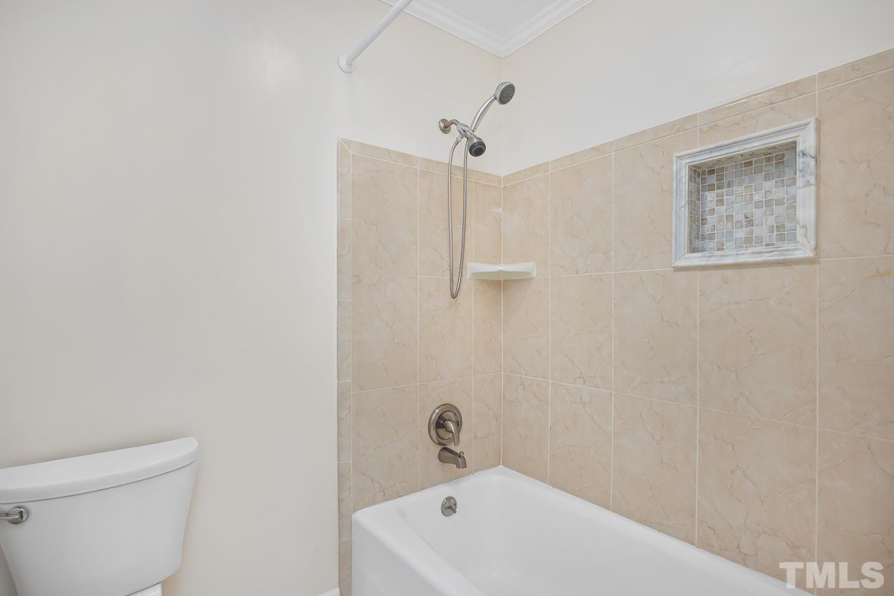 3100 Braddock Drive Raleigh, NC 27612 - Photo 21 of 40 a white bath tub sitting next to a white toilet