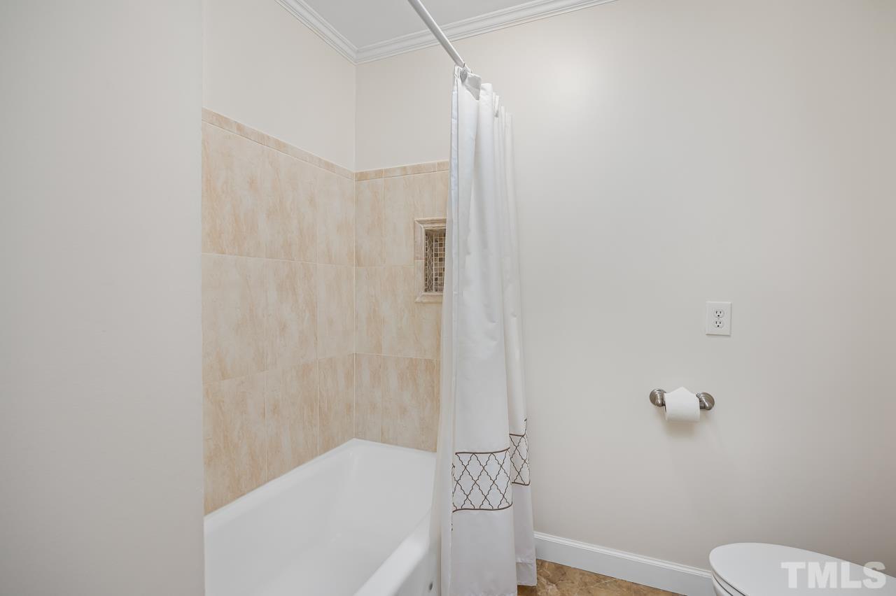 3100 Braddock Drive Raleigh, NC 27612 - Photo 26 of 40 a bathroom with a toilet and shower