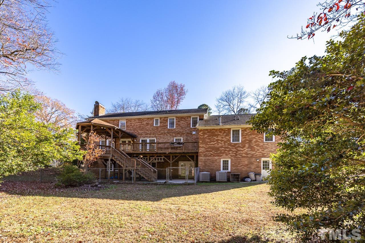 3100 Braddock Drive Raleigh, NC 27612 - Photo 39 of 40 a view of a house with a yard