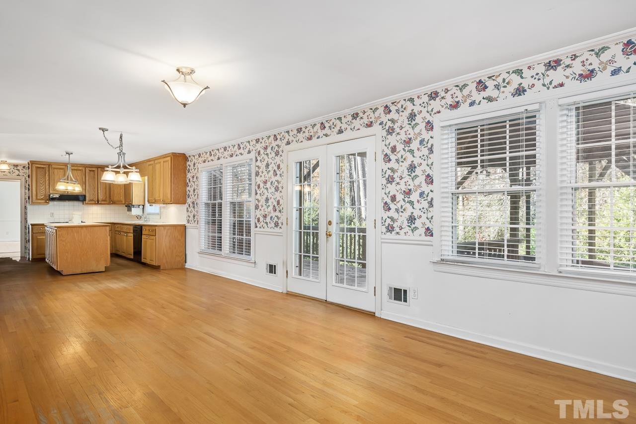 3100 Braddock Drive Raleigh, NC 27612 - Photo 8 of 40 a view of a big room with wooden cabinet and windows