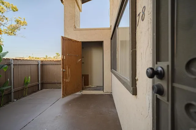 a kitchen with granite countertop cabinets and white appliances