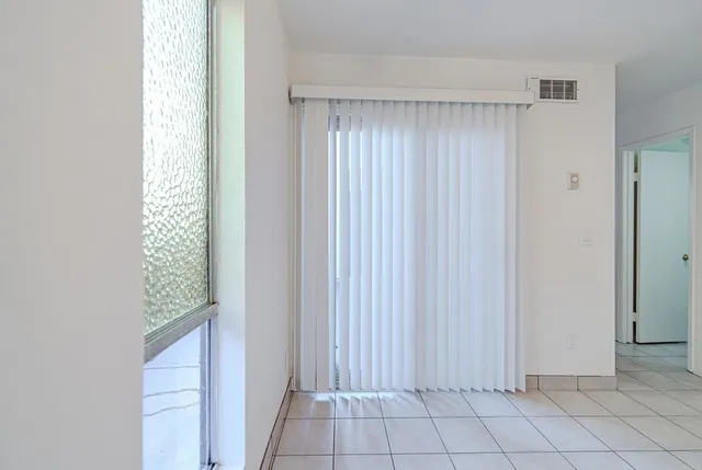 a bedroom with a bed and a chair