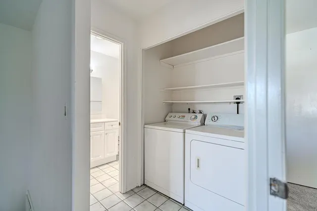 a view of an empty room and a window