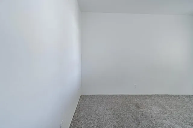 a view of a pathway with house on both side