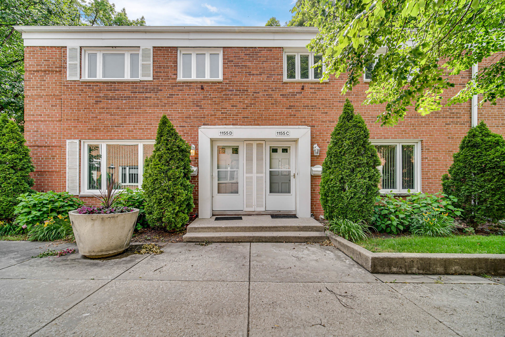 1155 Peterson Avenue, Unit C Park Ridge, IL 60068 - Photo 2 of 3 a house view with a garden space