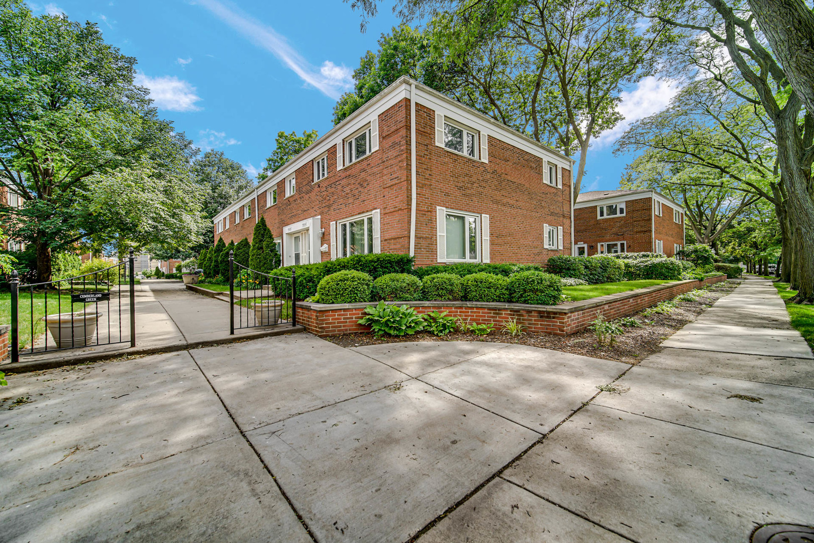 1155 Peterson Avenue, Unit C Park Ridge, IL 60068 - Photo 3 of 3 a front view of a house with a garden