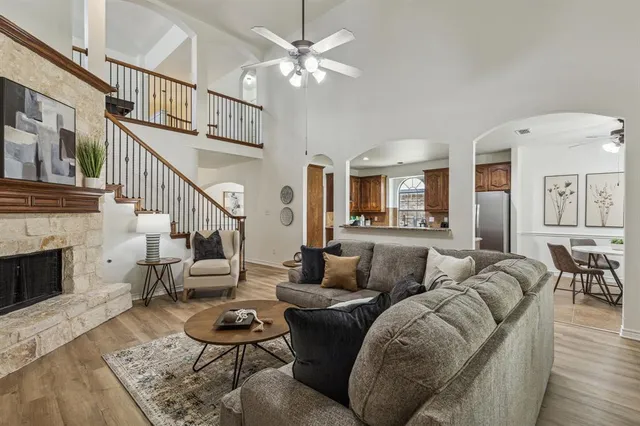 a living room with furniture and a fireplace