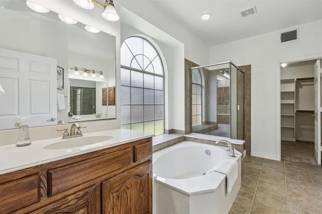 a bathroom with a sink double vanity and a mirror