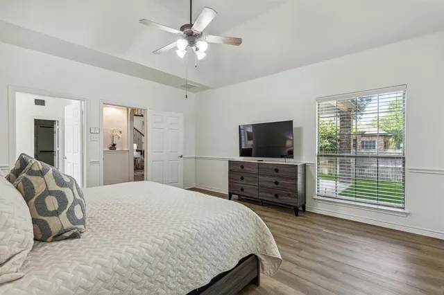 a spacious bathroom with a sink double vanity and a mirror